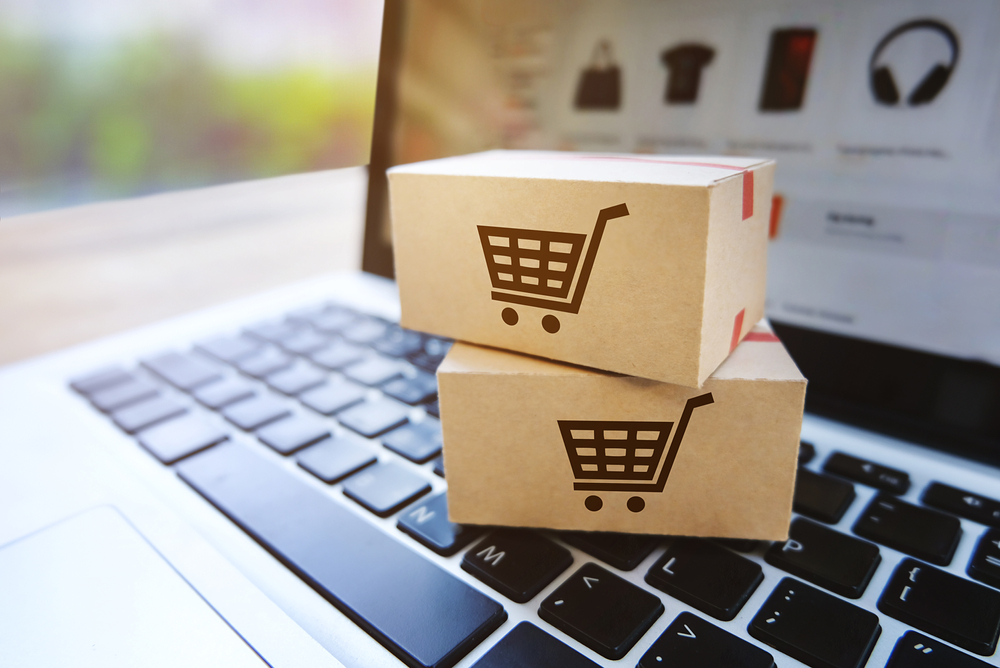 Parcel,Box,On,A,Laptop,With,Shopping,Service,On,The