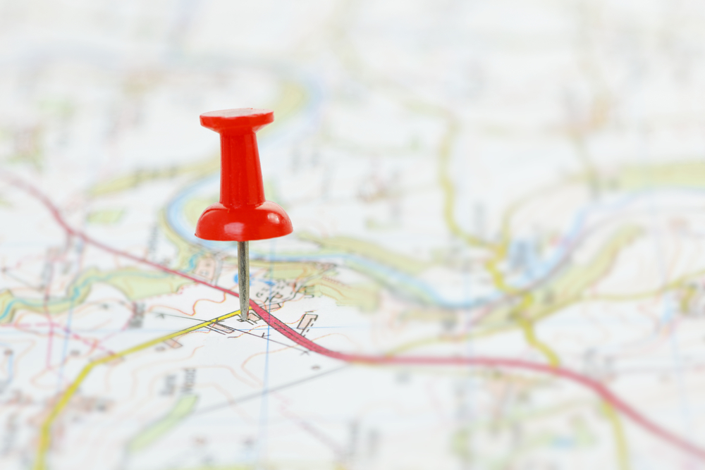 Map,With,Red,Pushpin,Marking,Destination.,Shallow,Dof.